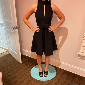 Cinq a sept black belted fit and flare dress. High neck. Very flattering!